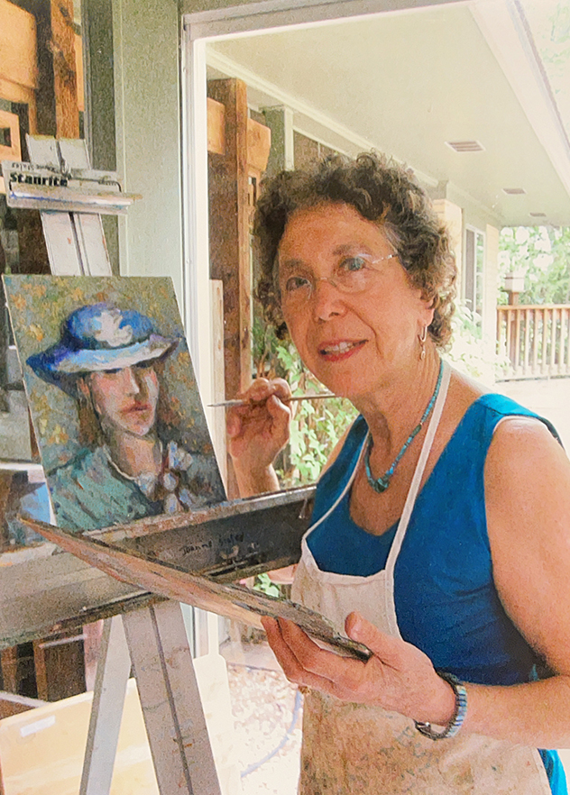 Portrait of Joanne Horvath Staley painting in her studio.